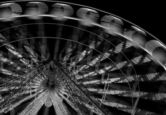 Illuminated ferris wheel at night